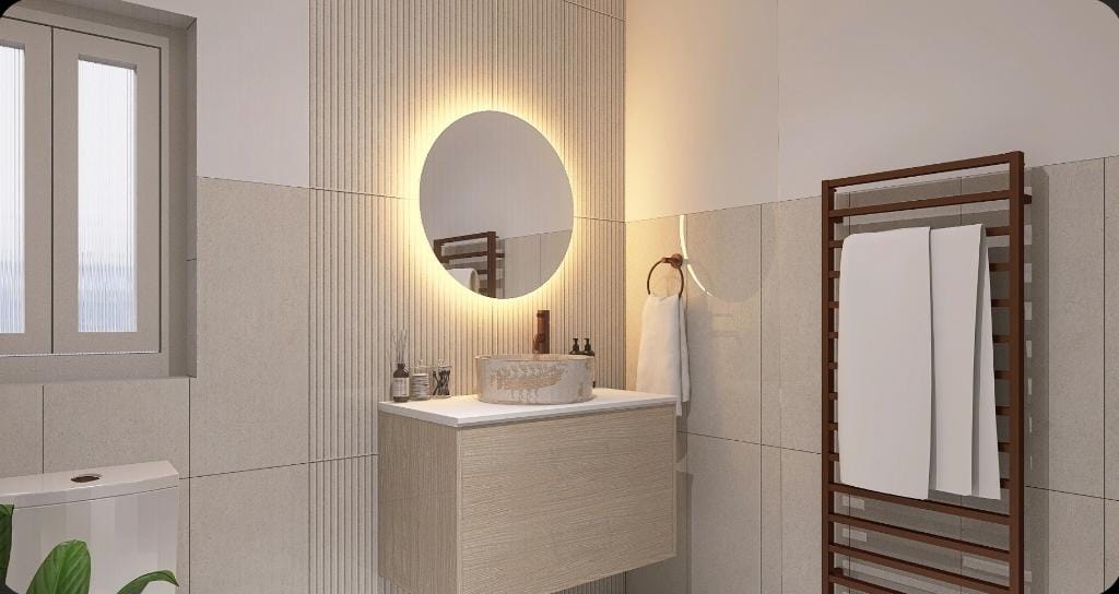 Bathroom design in Chelmsford with wall-hung vanity unit, backlit mirror, stone basin and neutral tiles with heated towel rail