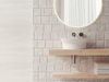 Porcelanosa Block Butan Bone 45x120cm shown in a styled room setting