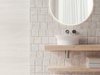Porcelanosa Block Butan Bone L 33.299999999999997x59.2cm shown in a styled room setting