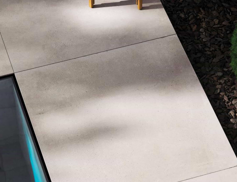 Porcelanosa Bottega Acero L 120x120cm shown in a styled room setting