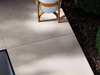 Porcelanosa Bottega Caliza Ant.l 120x120cm shown in a styled room setting