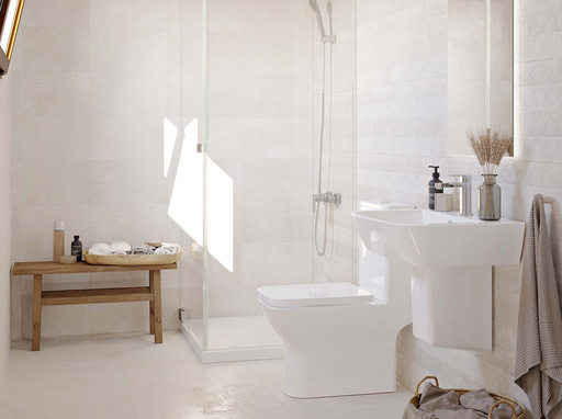 Porcelanosa Bottega Caliza L 25x44.3cm shown in a styled room setting