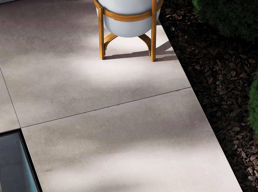 Porcelanosa Bottega Caliza L 60.2x60.2cm shown in a styled room setting