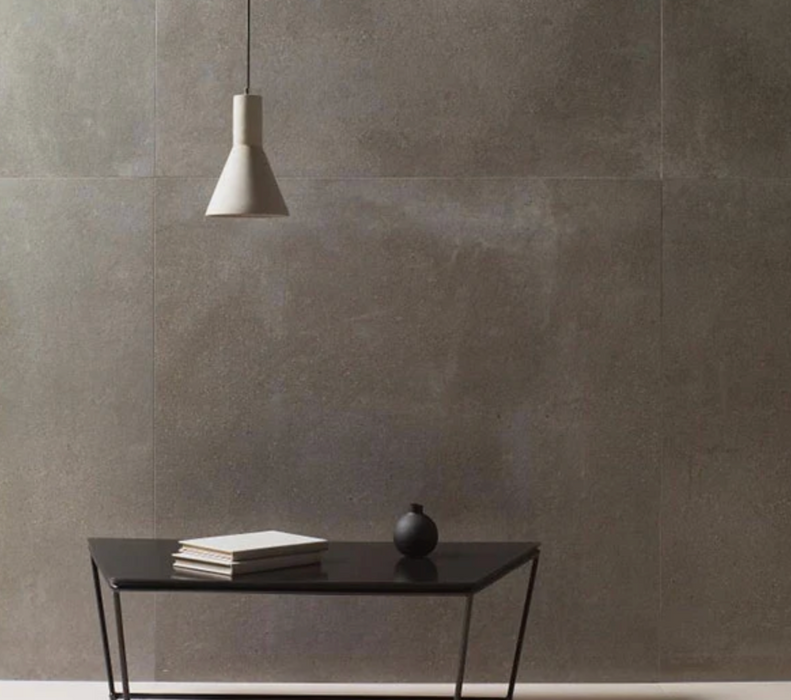 Porcelanosa Bottega Topo L 120x120cm shown in a styled room setting