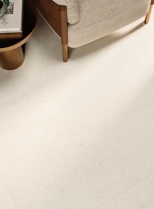 Porcelanosa Cancun Caliza L 120x120cm shown in a styled room setting