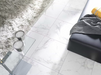 Porcelanosa Carrara Blanco Natural L 59.6x59.6cm shown in a styled room setting