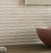 Porcelanosa Coin Saddle Caliza 45x120cm shown in a styled room setting