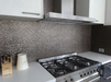 Porcelanosa Cubica Gris L 25x44.3cm shown in a styled room setting