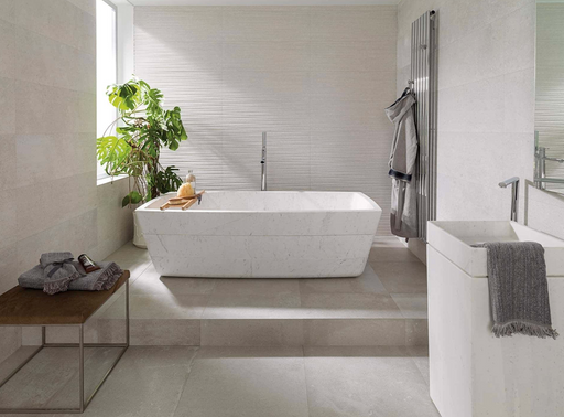 Porcelanosa Dover Caliza 33.299999999999997x100cm shown in a styled room setting