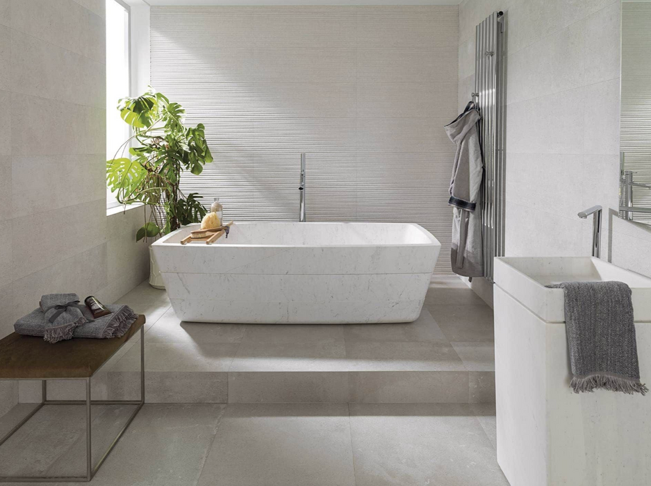 Porcelanosa Dover Caliza L 59.6x59.6cm shown in a styled room setting