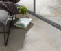 Porcelanosa Ferroker Aluminio L 44.3x44.3cm shown in a styled room setting