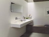 Porcelanosa Harlem Acero Ant.l 120x120cm shown in a styled room setting