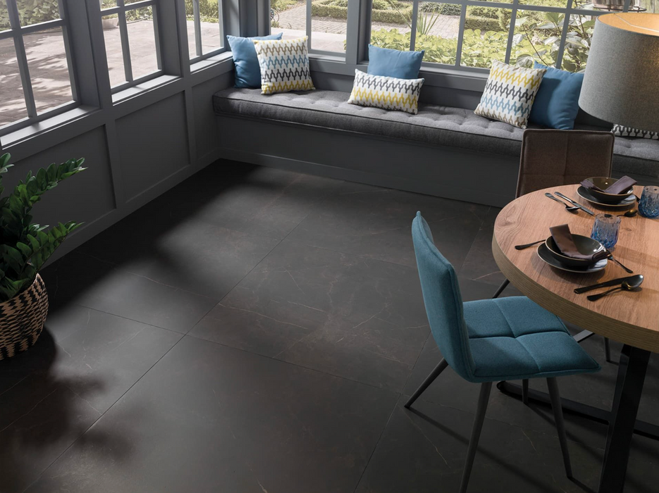 Porcelanosa Karachi Grey L 120x120cm shown in a styled room setting