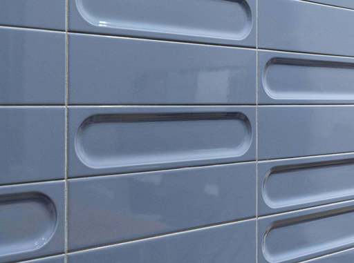 Porcelanosa Kent Navy Gloss 8x30x0.85 8x30cm shown in a styled room setting