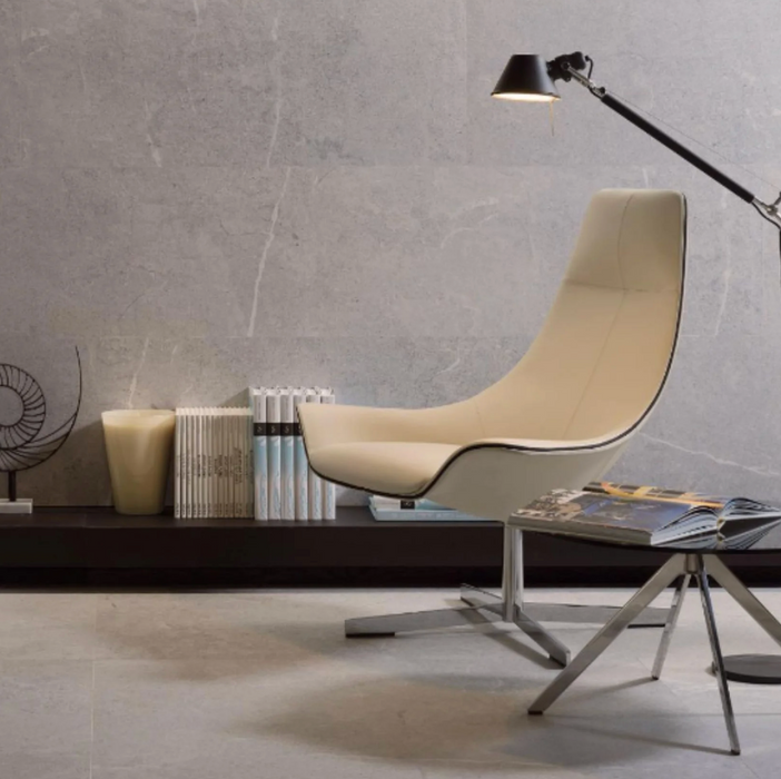 Porcelanosa Lucerna Acero Ant.l 120x120cm shown in a styled room setting
