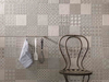 Porcelanosa Marbella Stone L 25x44.3cm shown in a styled room setting