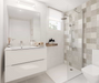 Porcelanosa Marbella Stone L 33.299999999999997x59.2cm shown in a styled room setting