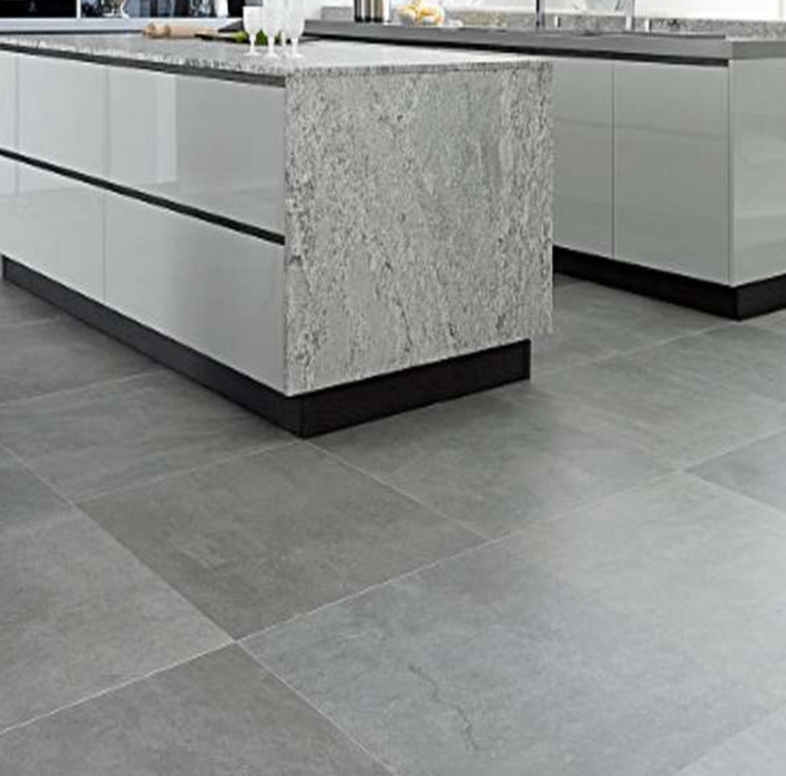 Porcelanosa Meaux Acero L 60.2x60.2cm shown in a styled room setting