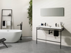 Porcelanosa Noir Caliza L 120x120cm shown in a styled room setting
