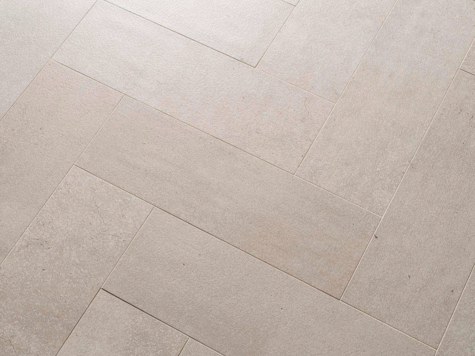 Porcelanosa Parma Limestone 14.2x44x0.85 14.2x44cm shown in a styled room setting