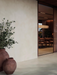 Porcelanosa Santorini Grey L 120x120cm shown in a styled room setting