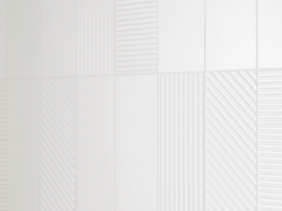 Porcelanosa Trend Snow 12.35x44.3x0.85 10x44.3cm shown in a styled room setting