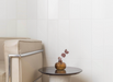 Porcelanosa Trend Snow 12.35x44.3x0.85 10x44.3cm shown in a styled room setting