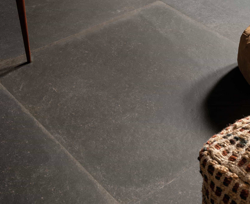 Porcelanosa Verbier Dark L 59.6x59.6cm shown in a styled room setting