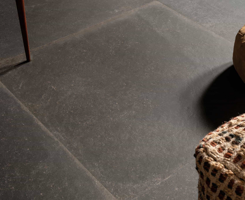 Porcelanosa Verbier Dark L 59.6x59.6cm shown in a styled room setting