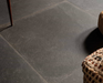 Porcelanosa Verbier Dark L 59.6x59.6cm shown in a styled room setting